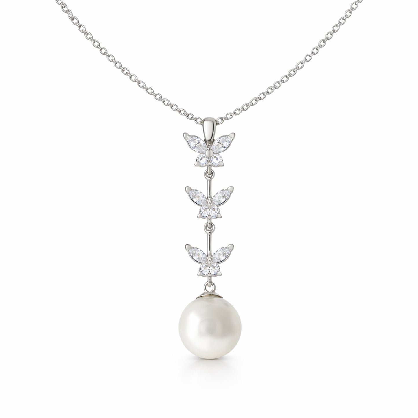 Studio view of a butterfly drop pendant featuring three marquise cut cubic zirconia butterfly elements arranged vertically with a round pearl drop.