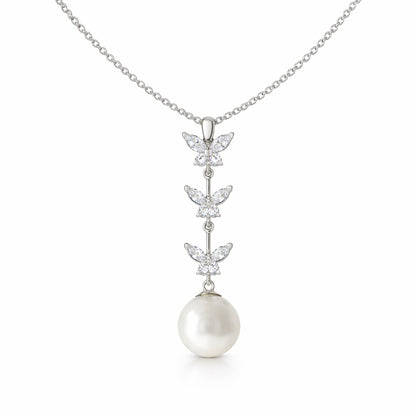 Studio view of a butterfly drop pendant featuring three marquise cut cubic zirconia butterfly elements arranged vertically with a round pearl drop.