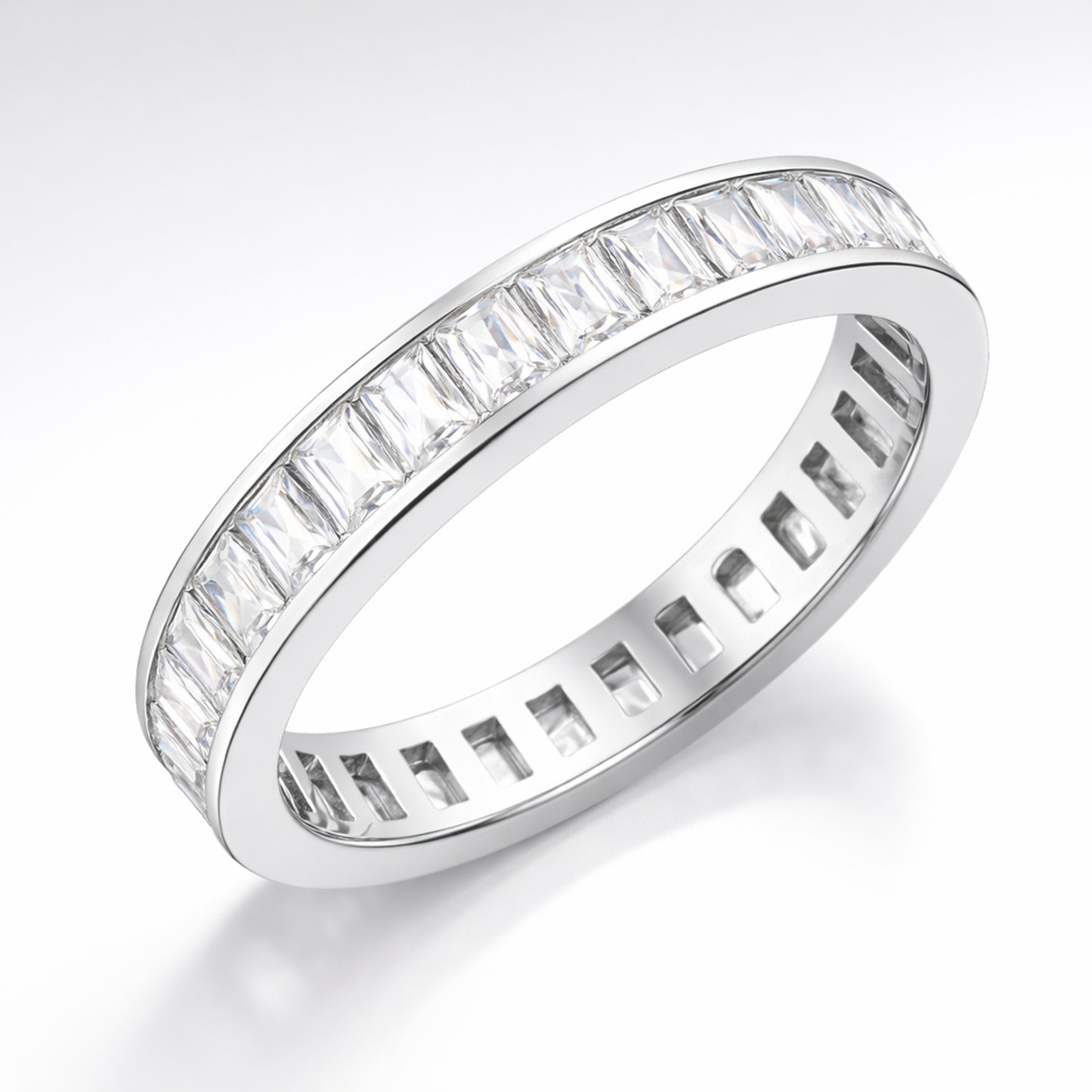 Studio view of a channel set baguette cut cubic zirconia ring in silver tone finish, shown centered on a white background and displaying the full ring profile.