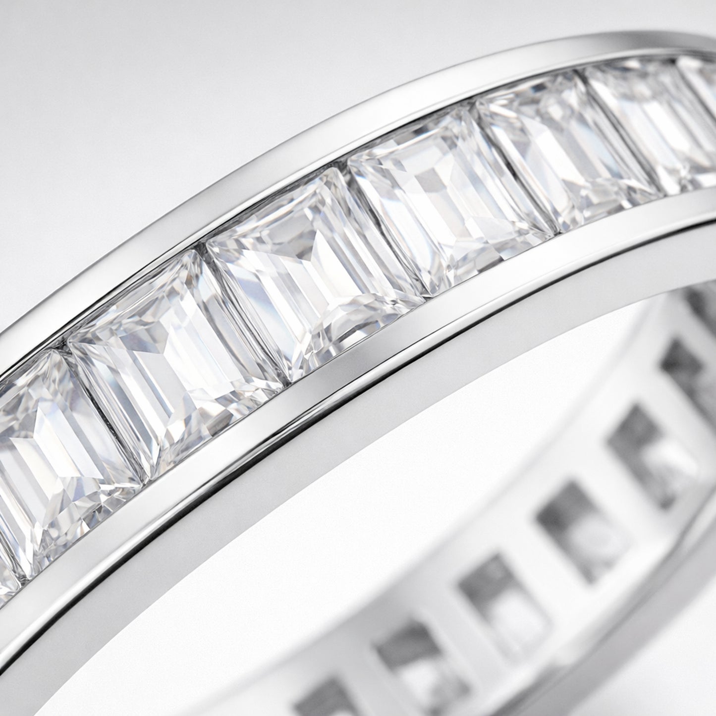 Studio view of the channel set baguette cut cubic zirconia ring showcasing the continuous channel setting and uniform rectangular stone alignment.