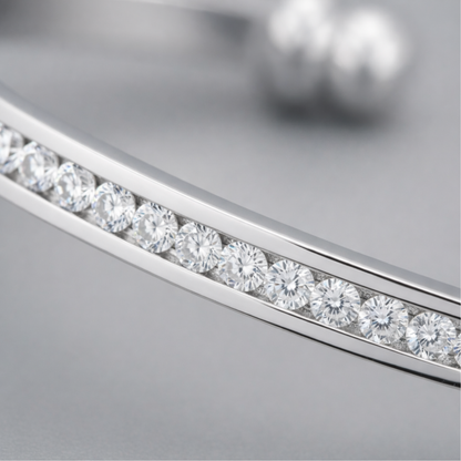 Close up view of the channel set cubic zirconia stones set in polished rhodium plated brass.