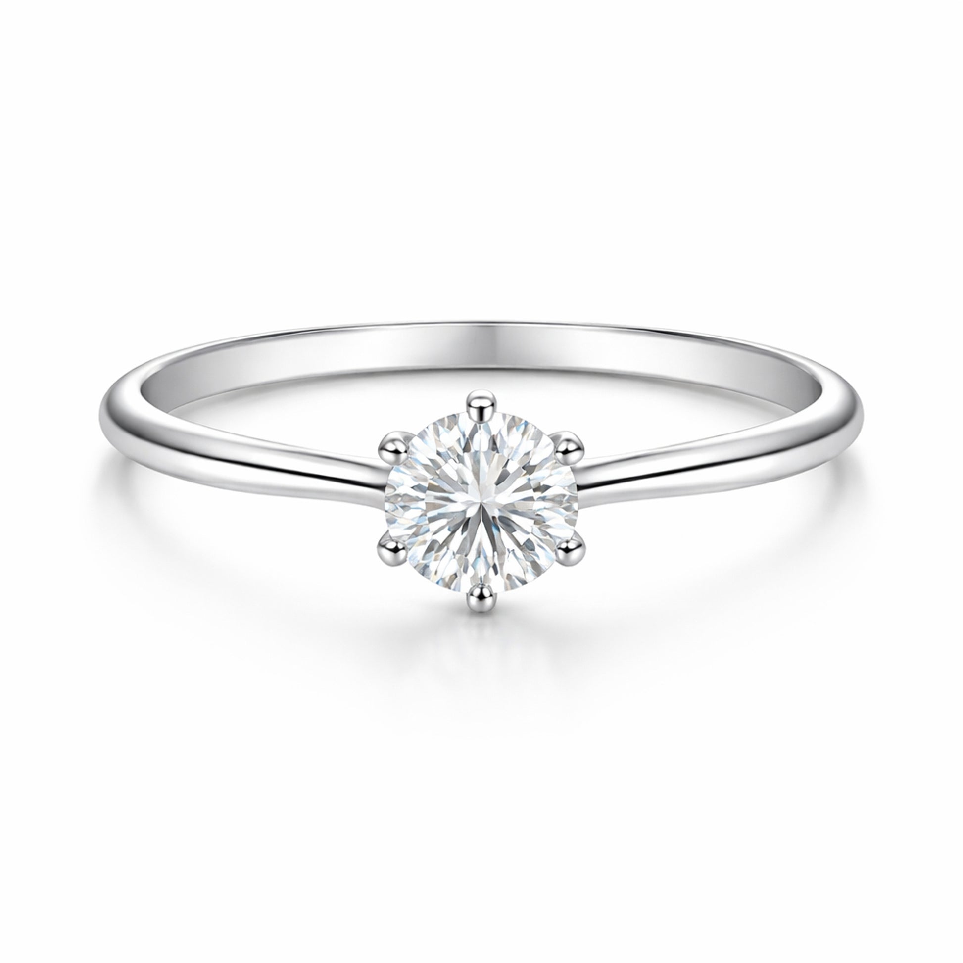 Studio view of the classic solitaire cubic zirconia ring in silver tone finish, centered on a clean background and featuring a round cut center stone in a prong setting.