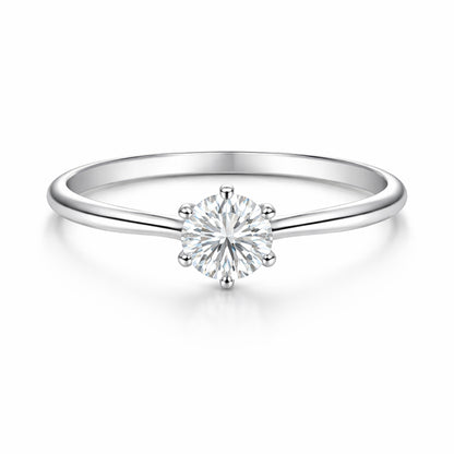 Studio view of the classic solitaire cubic zirconia ring in silver tone finish, centered on a clean background and featuring a round cut center stone in a prong setting.