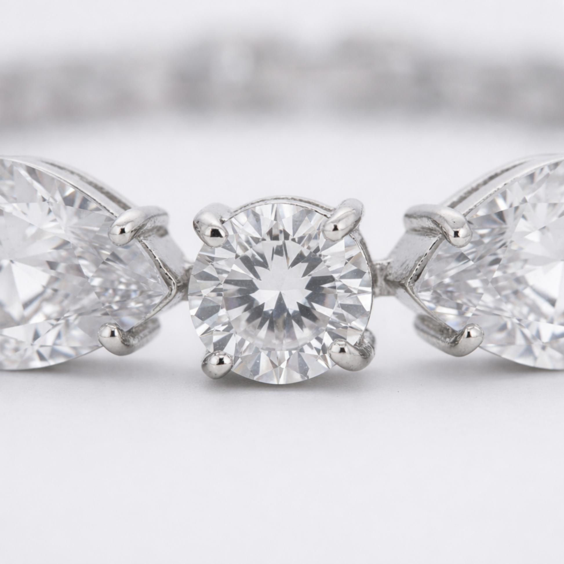 Close up detail of cubic zirconia stones and precise setting in rhodium plated brass.