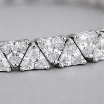 Close up detail of cubic zirconia stones and precise setting in rhodium plated brass.