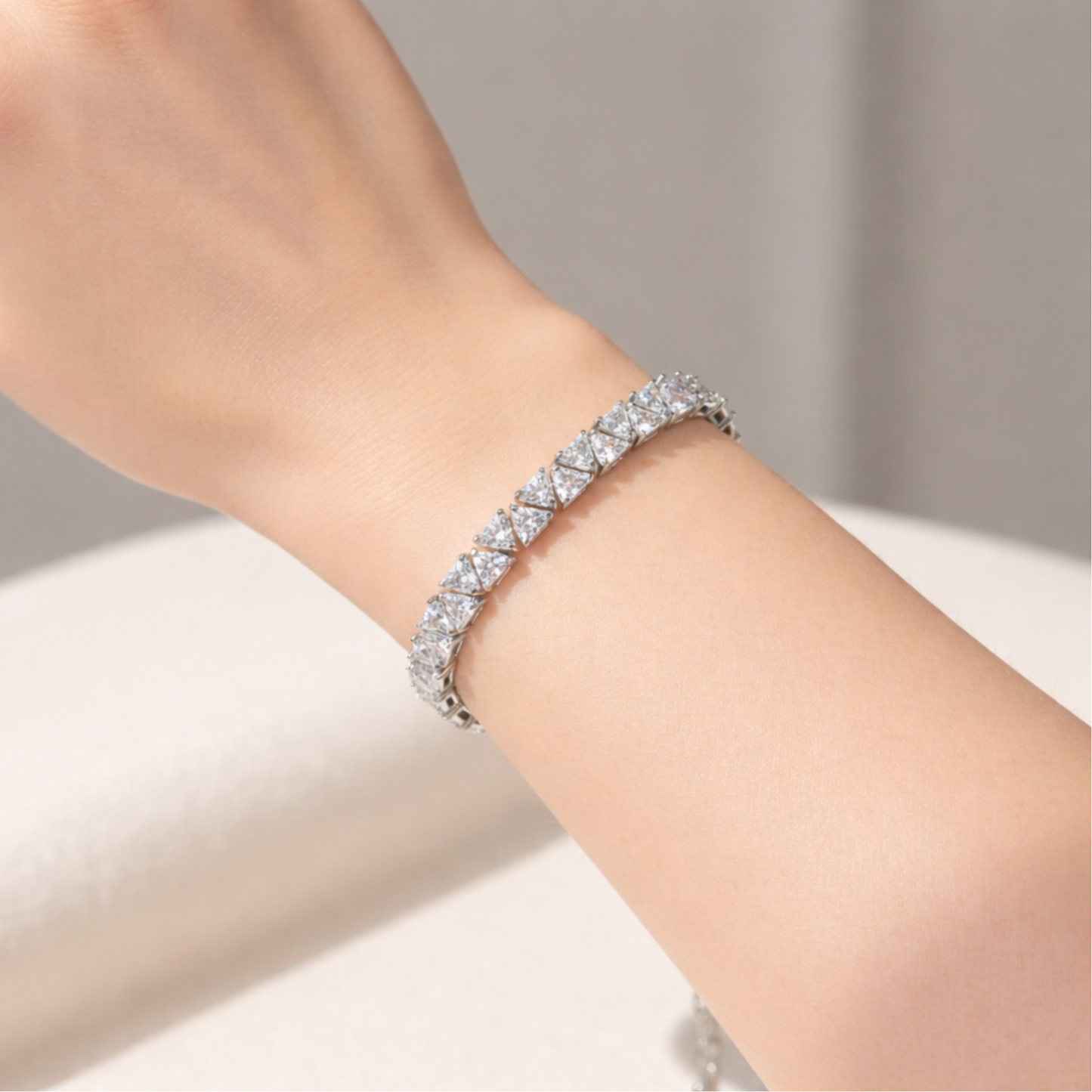 Divinity tennis bracelet worn on the wrist, highlighting elegant proportions and refined sparkle.