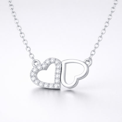 Studio view of the double heart cubic zirconia pendant centered to show the balanced heart design.