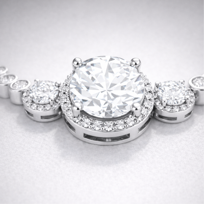 Close up view of the halo style centerpiece with round cut cubic zirconia stones in silver tone setting.