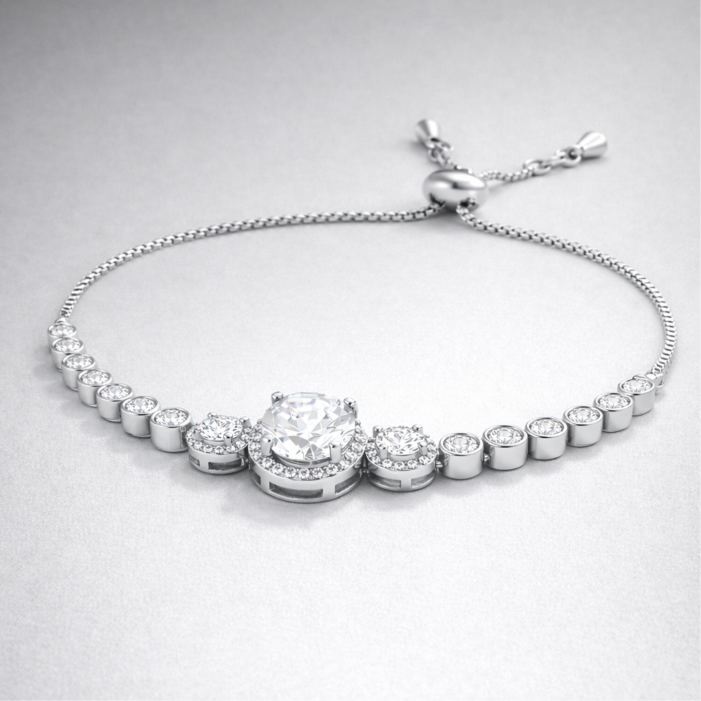 Close up view of the halo style centerpiece with round cut cubic zirconia stones in silver tone setting.