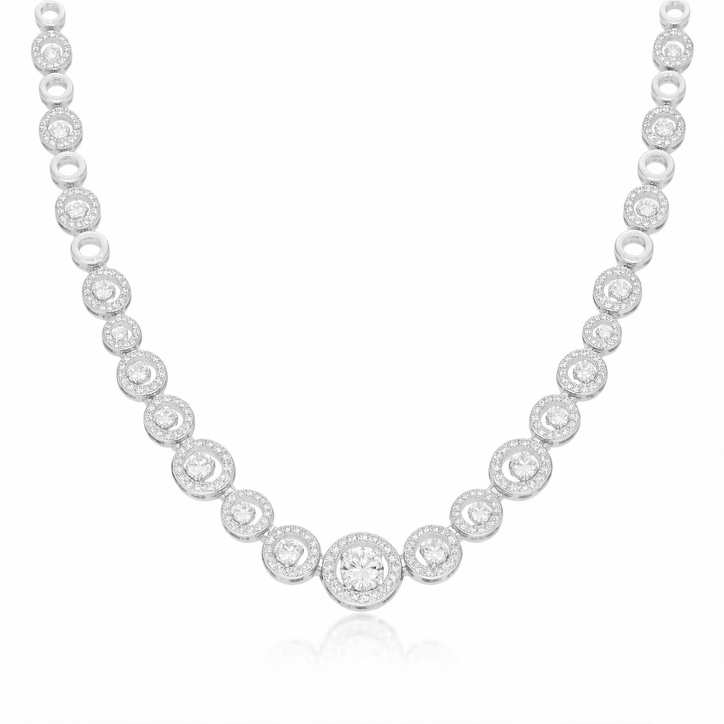Front facing studio image of a halo style silver tone necklace featuring round cubic zirconia stones.