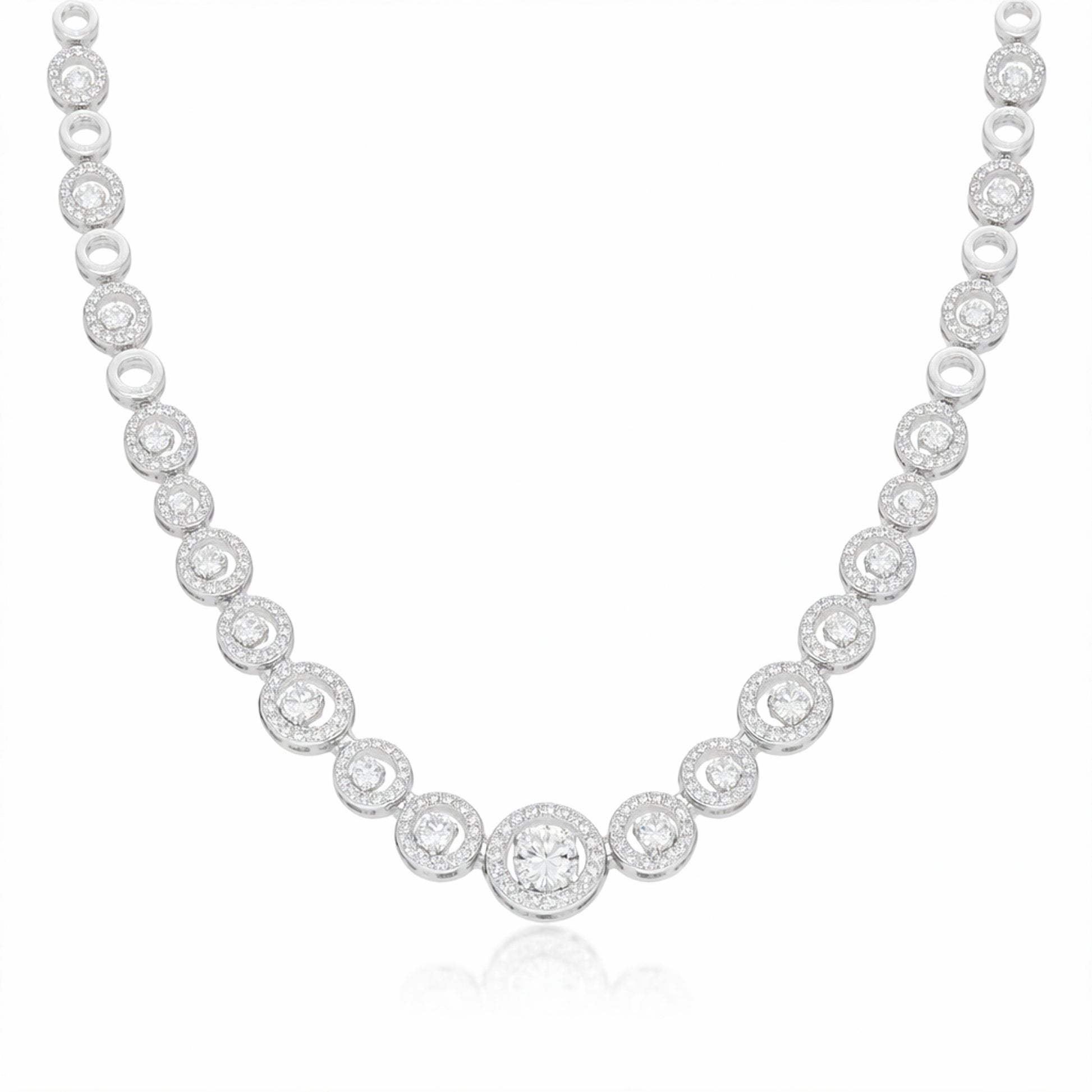 Front facing studio image of a halo style silver tone necklace featuring round cubic zirconia stones.