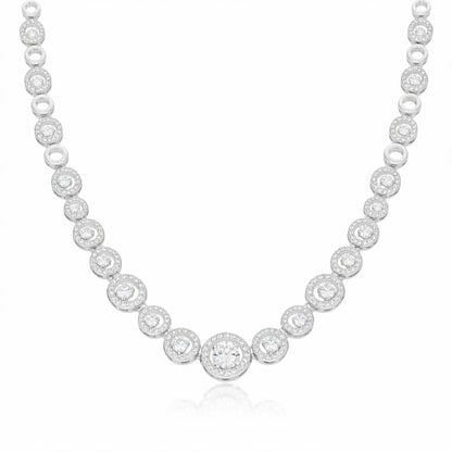 Front facing studio image of a halo style silver tone necklace featuring round cubic zirconia stones.