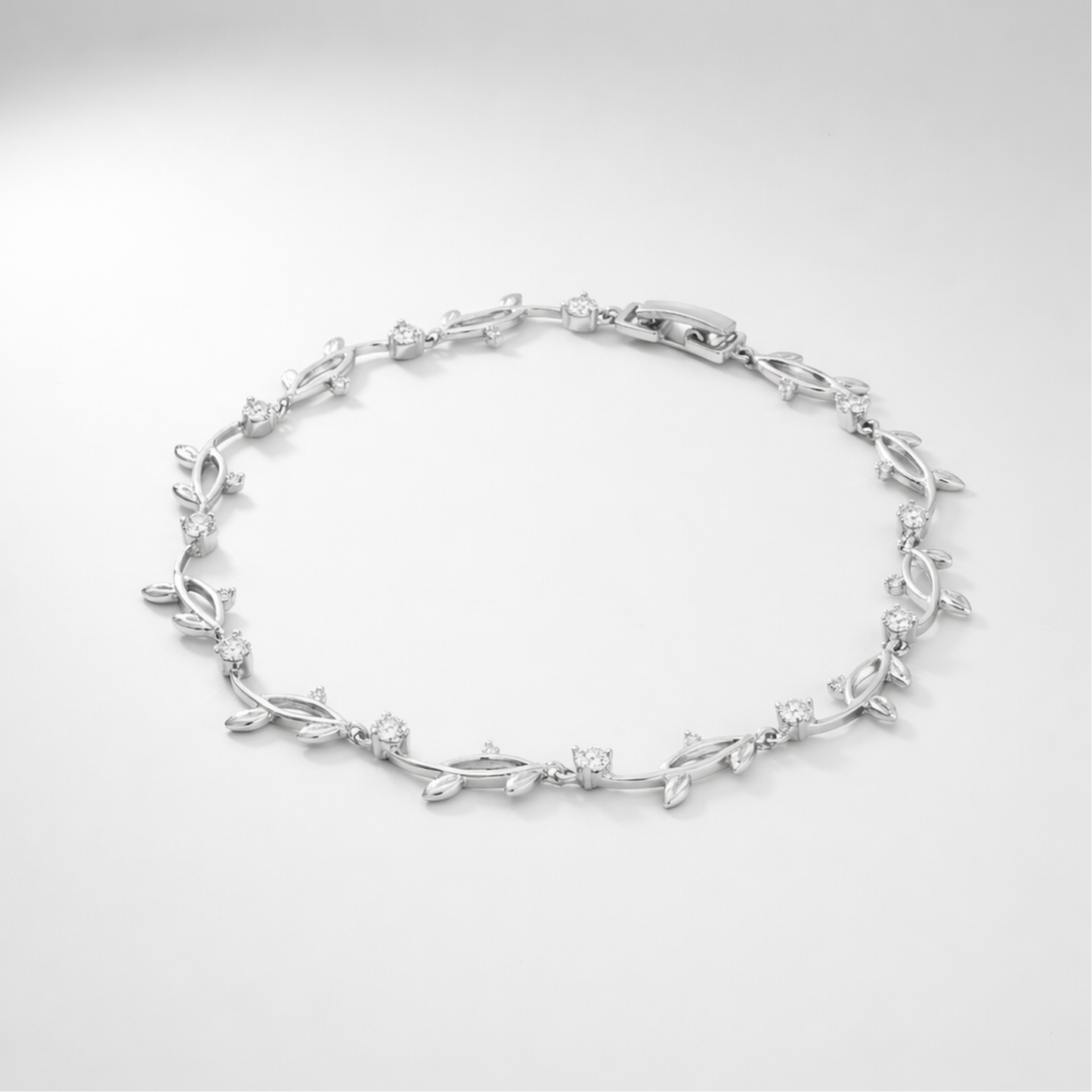 Studio view of a delicate leaf motif bracelet with cubic zirconia stones arranged in an elegant pattern.