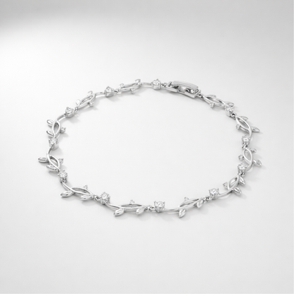 Studio view of a delicate leaf motif bracelet with cubic zirconia stones arranged in an elegant pattern.
