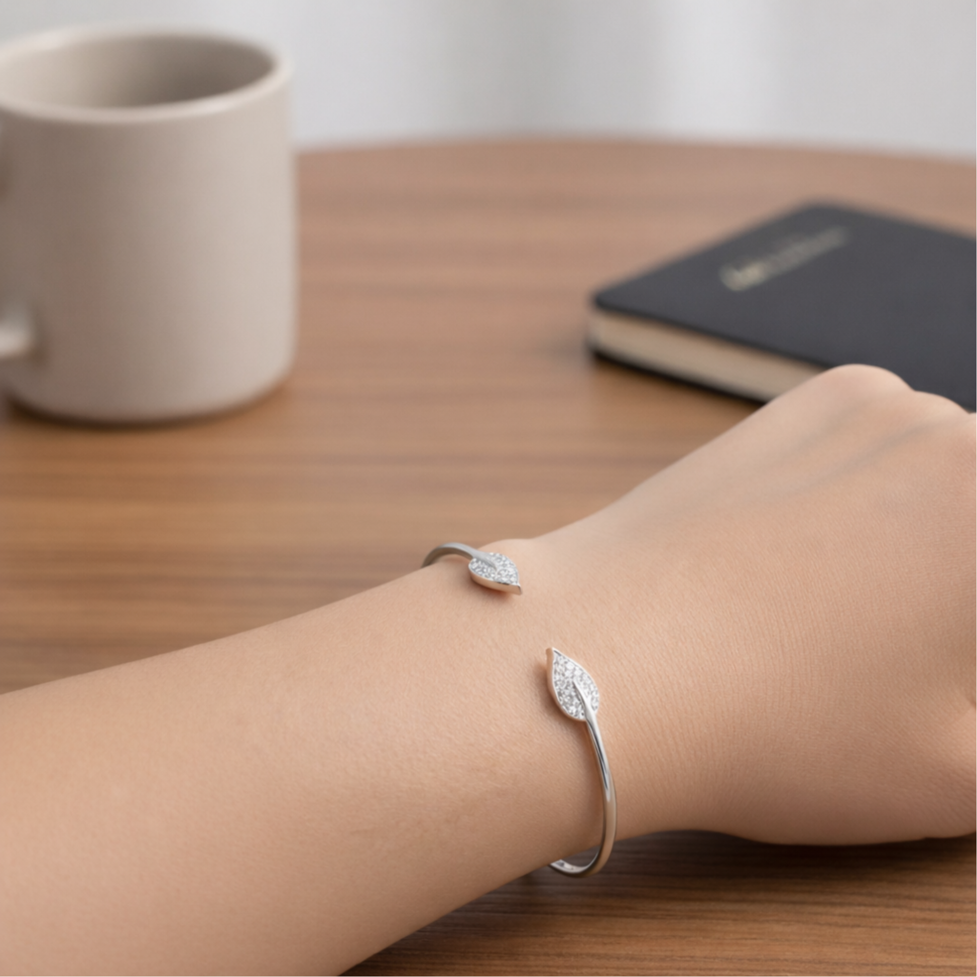 Open cuff bracelet worn on the wrist, highlighting modern shape and comfortable fit.