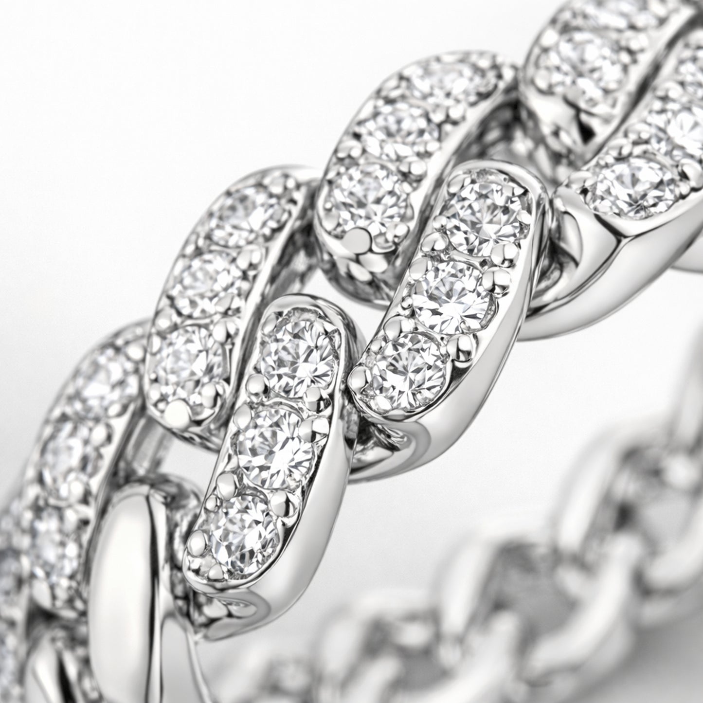 Close up view of the pavé chain link cubic zirconia ring highlighting the interlocking links and pavé stone setting.