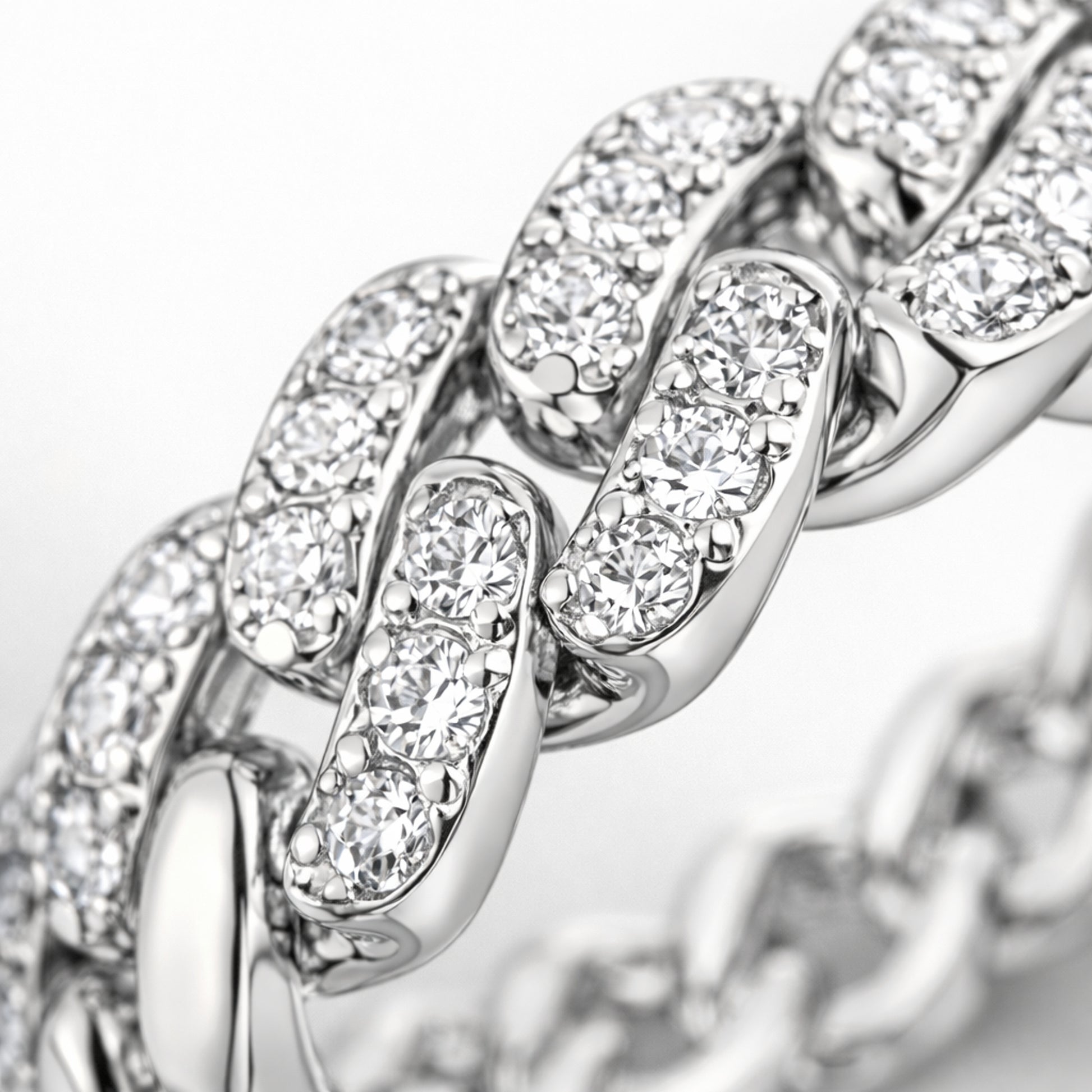 Close up view of the pavé chain link cubic zirconia ring highlighting the interlocking links and pavé stone setting.