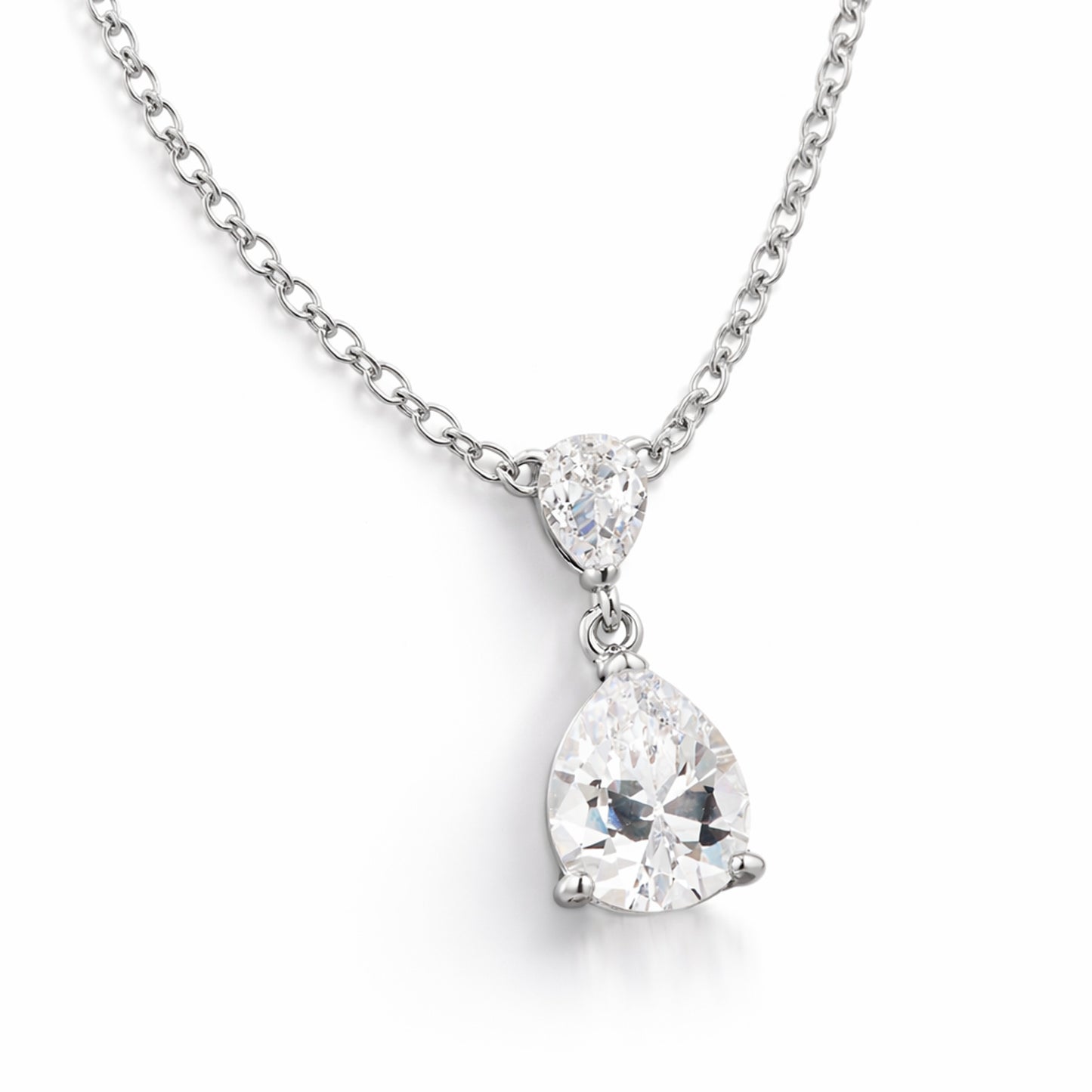 Angled studio view showing the pear shaped cubic zirconia stones in prong settings connected in an elegant drop design.