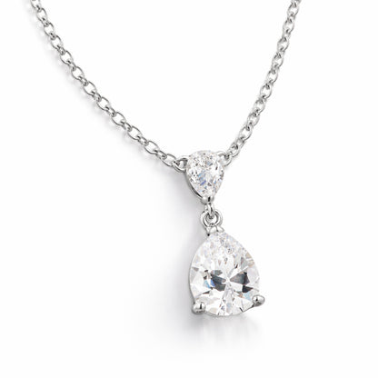 Angled studio view showing the pear shaped cubic zirconia stones in prong settings connected in an elegant drop design.