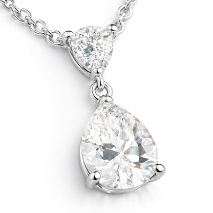 Close up view of the pear shaped cubic zirconia pendant highlighting the faceted stones and polished silver tone prong setting.