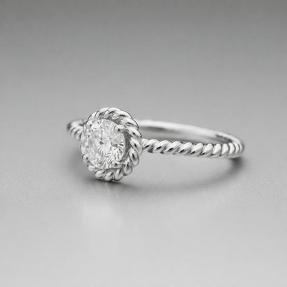 Angled view of the rope style solitaire cubic zirconia ring showing the raised solitaire setting and twisted shank design.