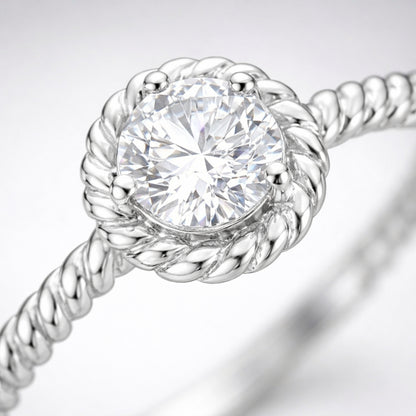 Close up view of the rope style solitaire cubic zirconia ring highlighting the twisted band texture and round center stone.