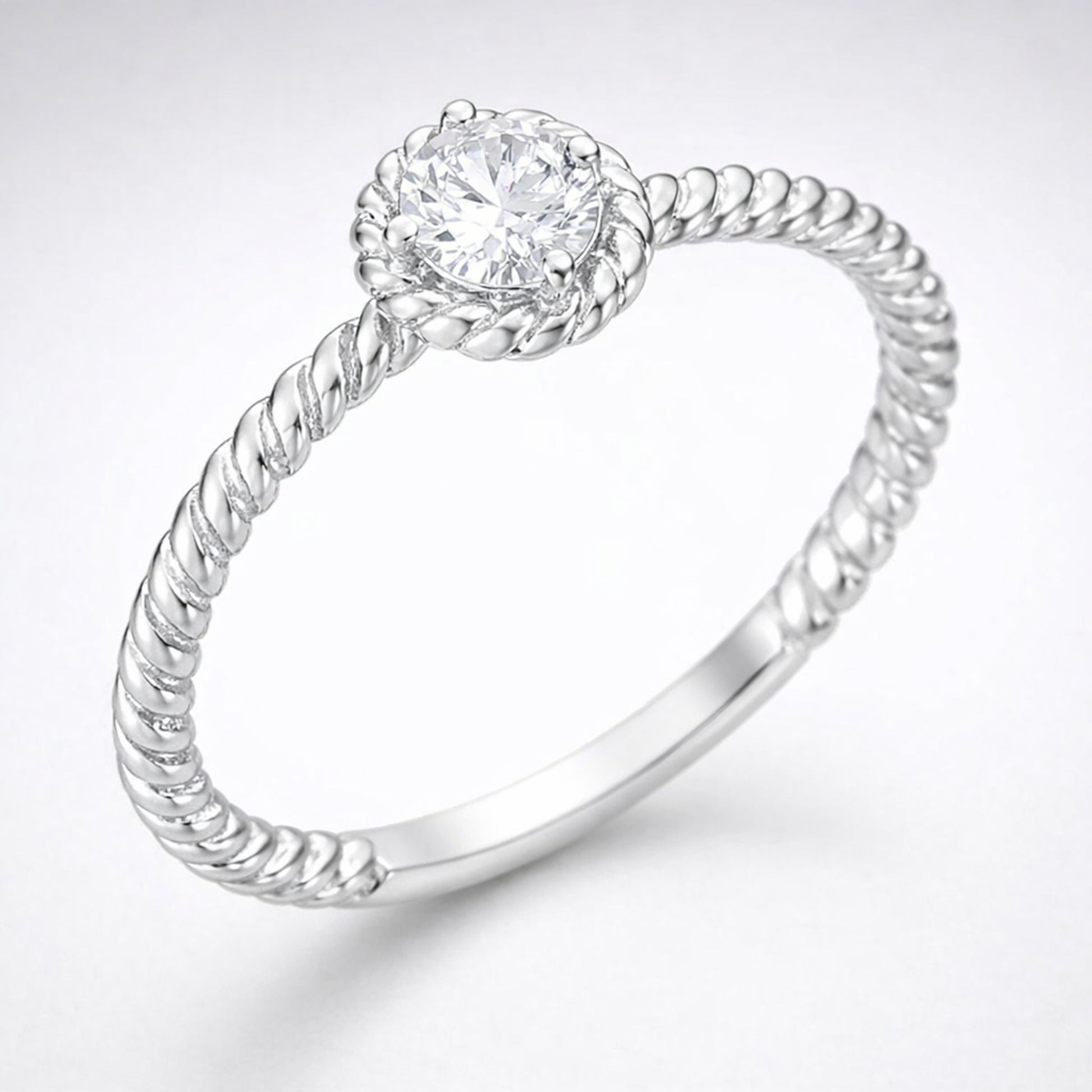 Side profile view of the rope style solitaire cubic zirconia ring showing the band curvature and solitaire setting height.