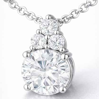 Close up detail of the round cut cubic zirconia pendant focusing on the prong setting accent stones and polished finish.