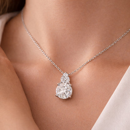 Worn view of the round cut cubic zirconia pendant illustrating size and balanced proportions.