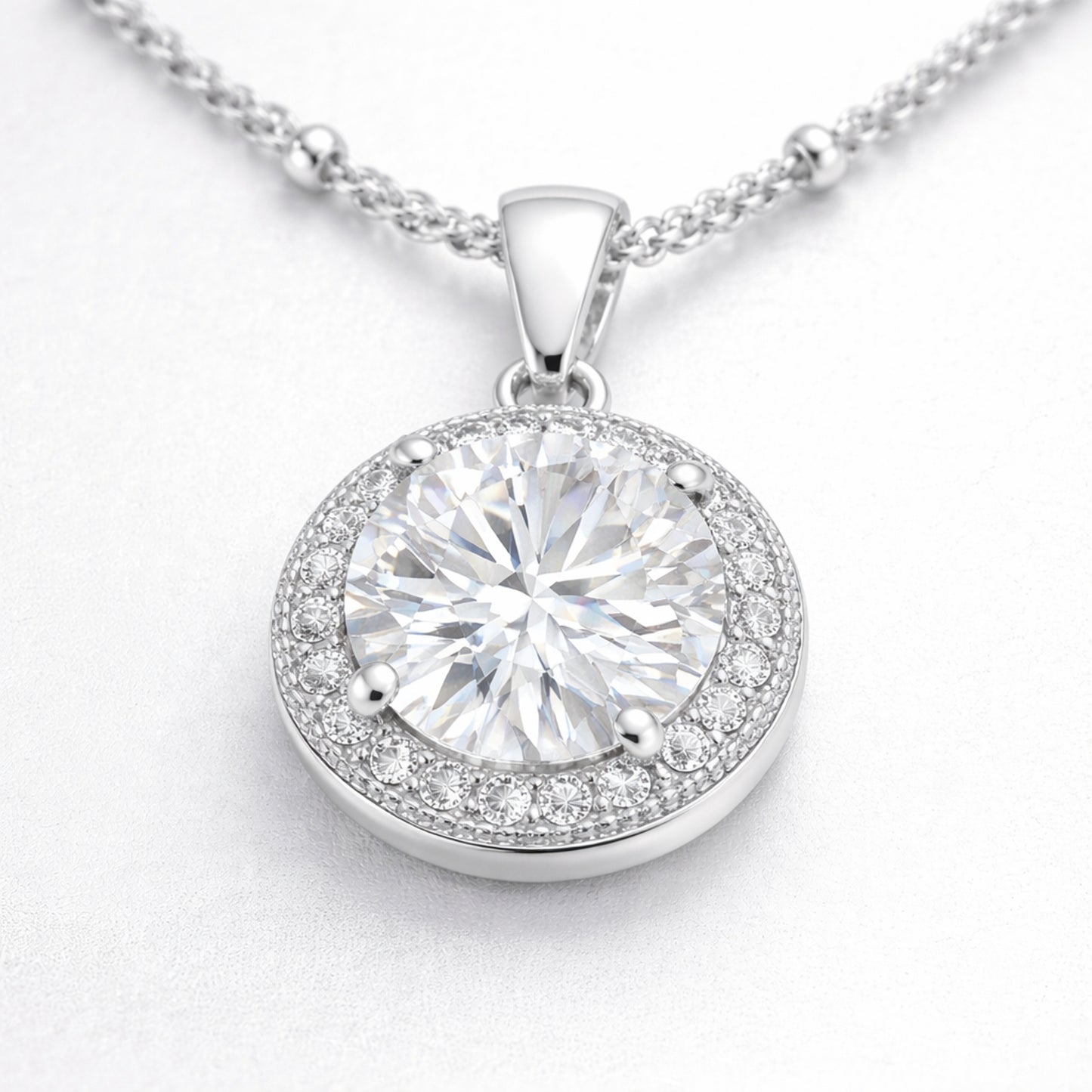 Close up view of the round halo cubic zirconia pendant focusing on the stone facets and detailed halo setting.