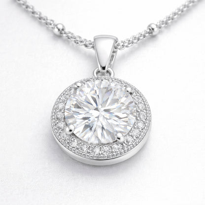Close up view of the round halo cubic zirconia pendant focusing on the stone facets and detailed halo setting.