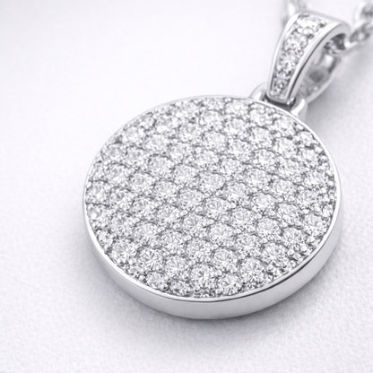 Close up view of the round pavé cubic zirconia pendant highlighting the detailed stone setting and smooth silver tone finish.