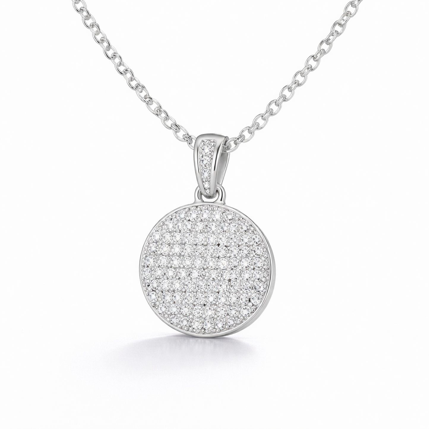 Studio view of a round pavé cubic zirconia pendant highlighting the circular shape and pavé set stones.