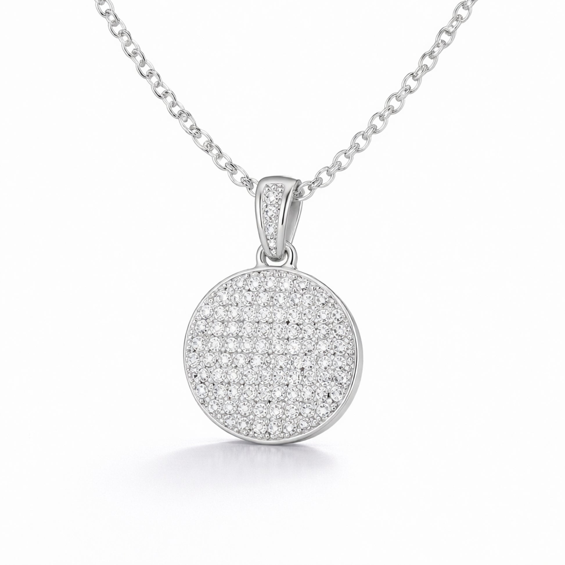 Studio view of a round pavé cubic zirconia pendant highlighting the circular shape and pavé set stones.
