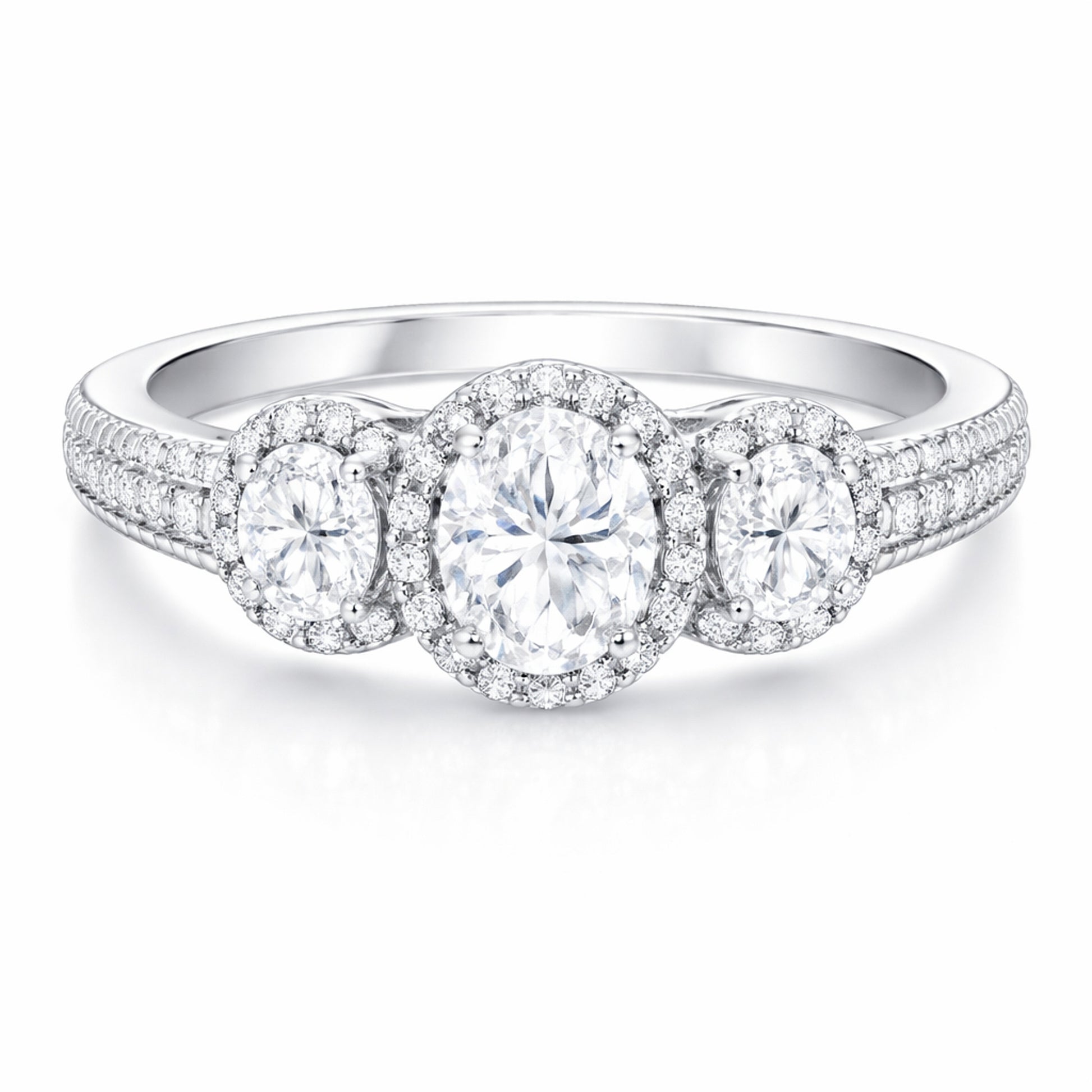 Front facing studio view of a three stone halo cubic zirconia ring in silver tone finish with symmetrical stone arrangement.